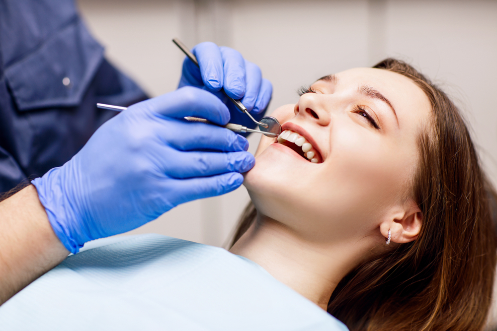 Dental Exams and Cleaning. Happy and comfortable patient